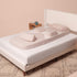 The Resting Roo Maternity Sleep System shown assembled on a bed
